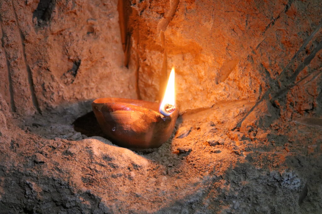 Tallow lamp ignited and lit in the qanat